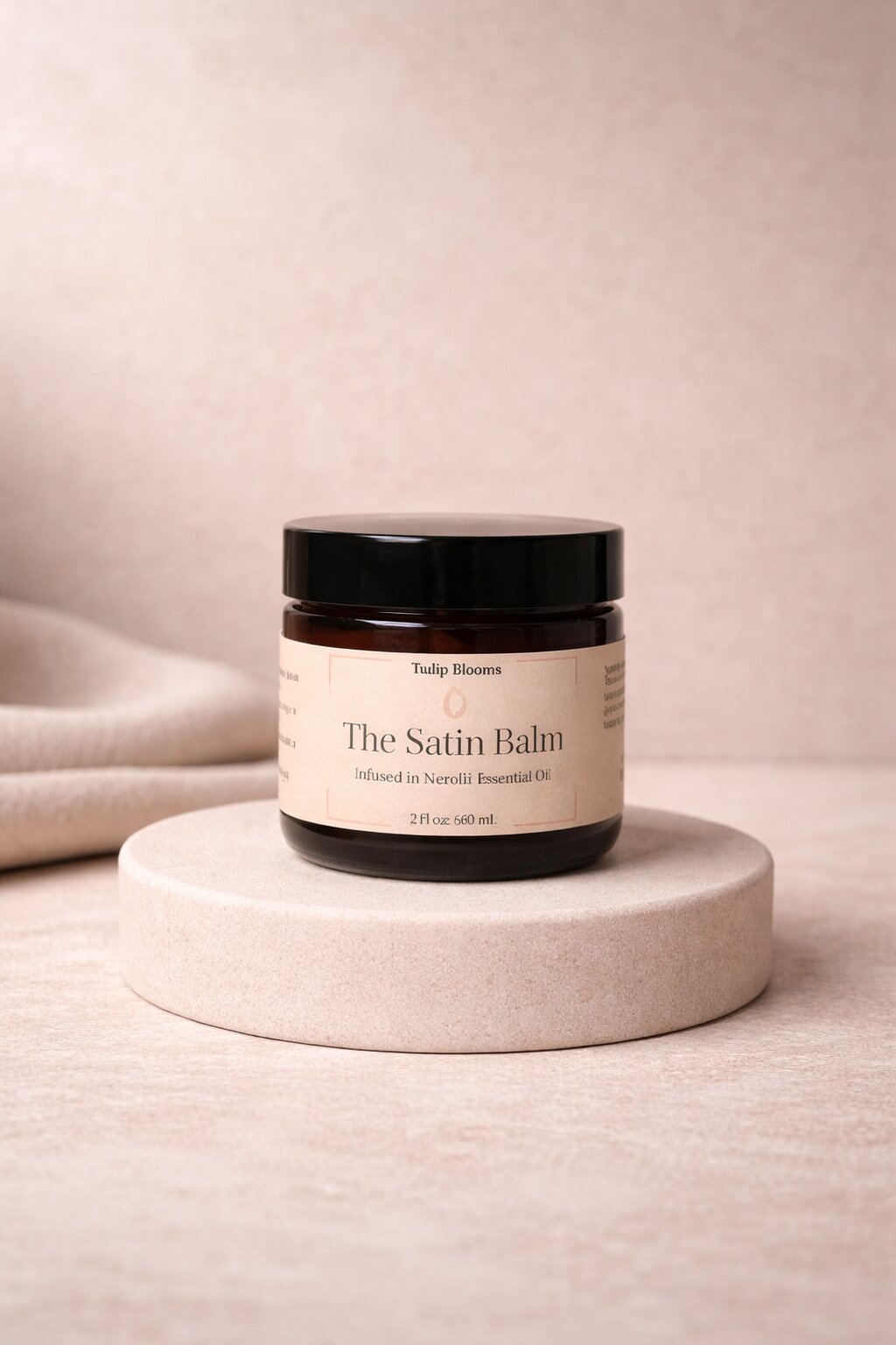 Satin Balm jar sitting on gold pedastool