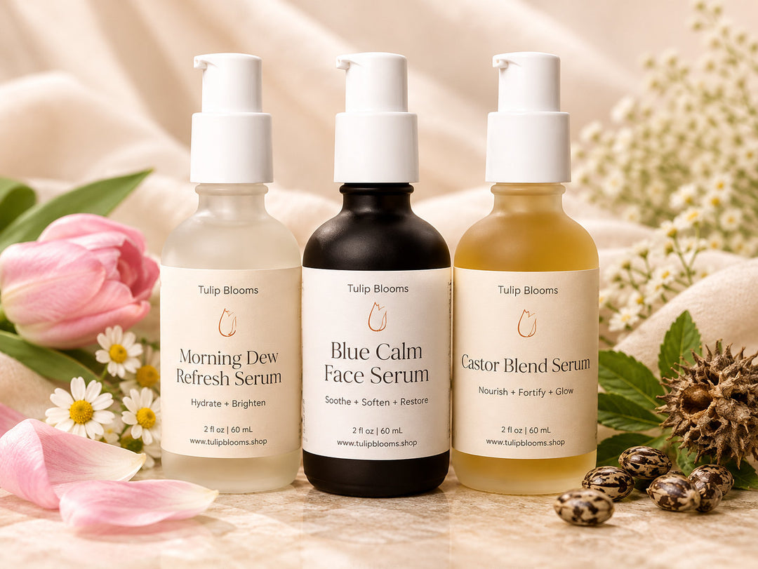 Tulip Blooms Youthful Serum Set featuring Morning Dew, Blue Calm Face Serum, and Castor Blend in glass pump bottles.